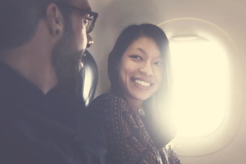 couple next to airplane window